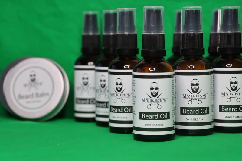 MyKey's own beard oil bottles and balm tin lined up